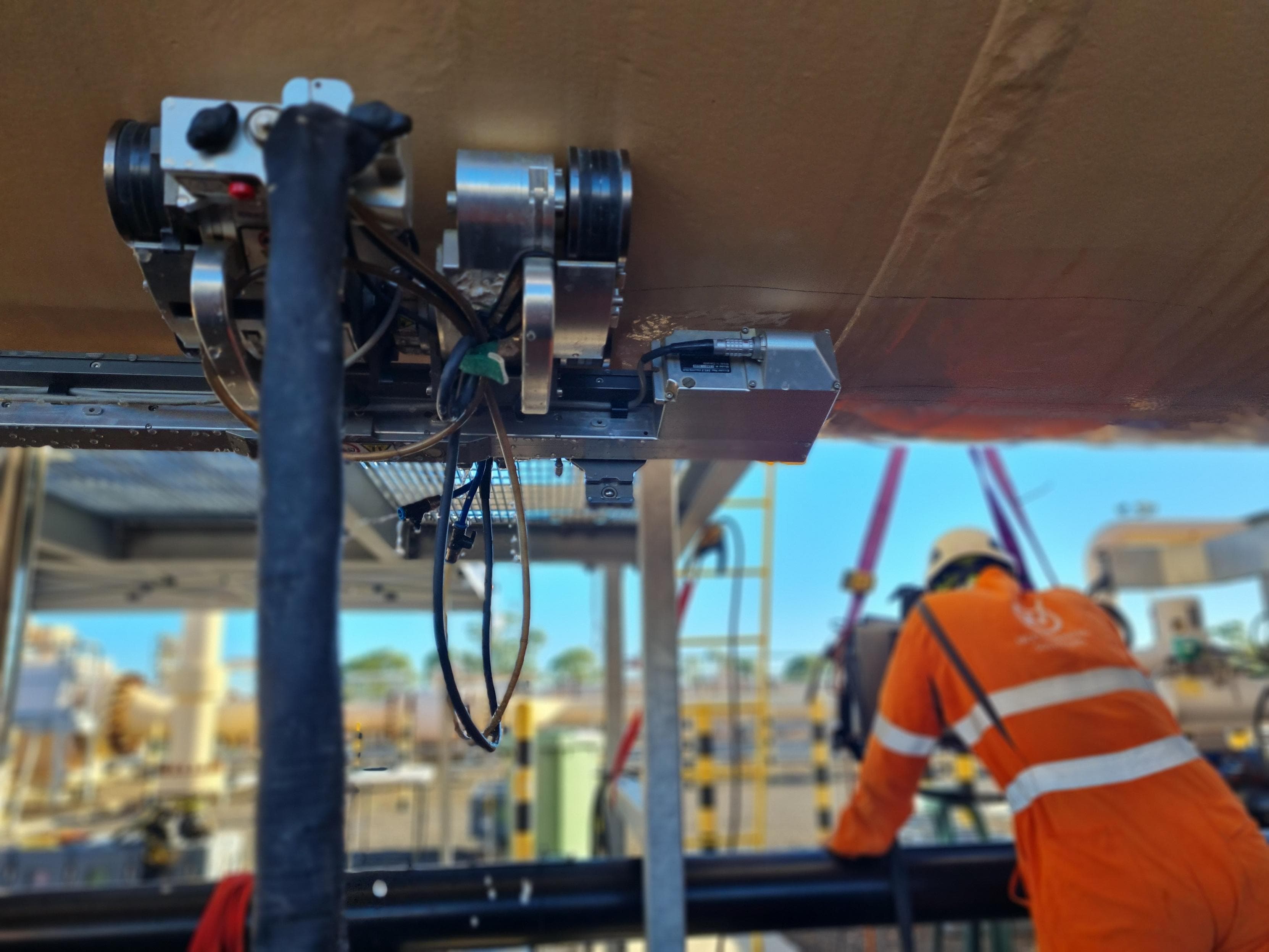 Technician conducting external inspection at a live asset